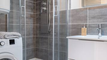 Shower, hair dryer, towels, soap