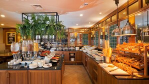 A buffet area with various food items and serving utensils. - Aspera Hotel Golden Horn (Istanbul)