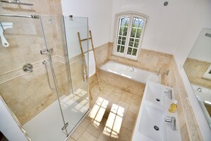 Bathtub, hair dryer, towels, soap