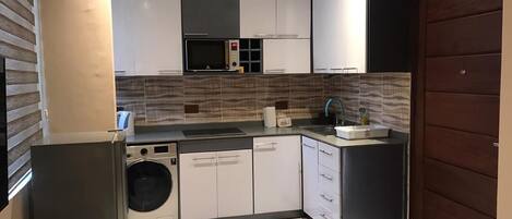 Fridge, microwave, stovetop, coffee/tea maker