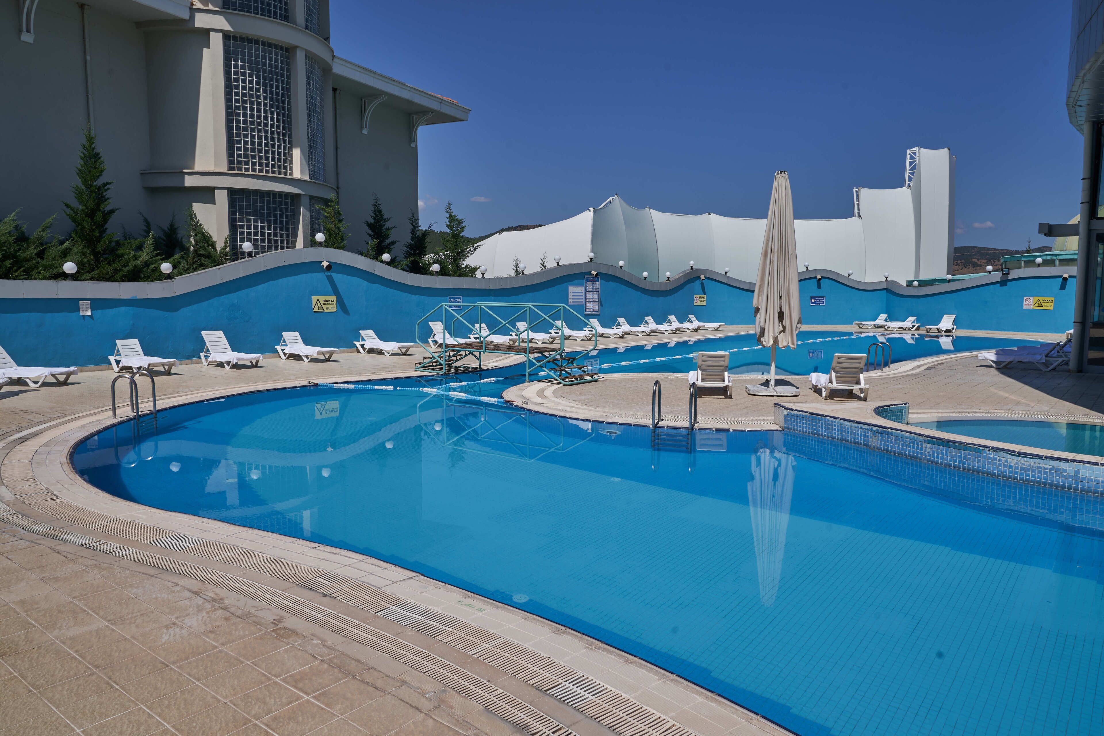 2 indoor pools, seasonal outdoor pool, pool umbrellas, pool loungers