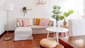 Deluxe Apartment | Living area | 24-inch flat-screen TV with digital channels, TV