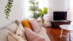 Deluxe Apartment | Living area | 24-inch flat-screen TV with digital channels, TV