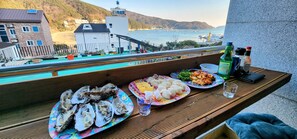 Outdoor dining - Beach Getaway (Suite 201) for 1 - 3 guests: Perfect Location & Great Views. (Geoje-si)
