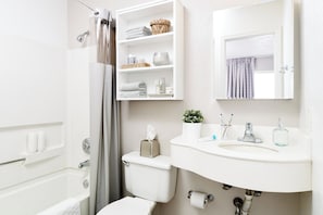Combined shower/tub, towels, soap, toilet paper - InTown Suites Extended Stay Indianapolis IN - I-70/Post Road (Indianapolis)