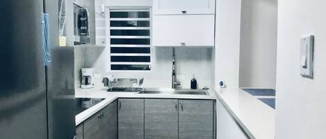 Fridge, microwave, stovetop, coffee/tea maker