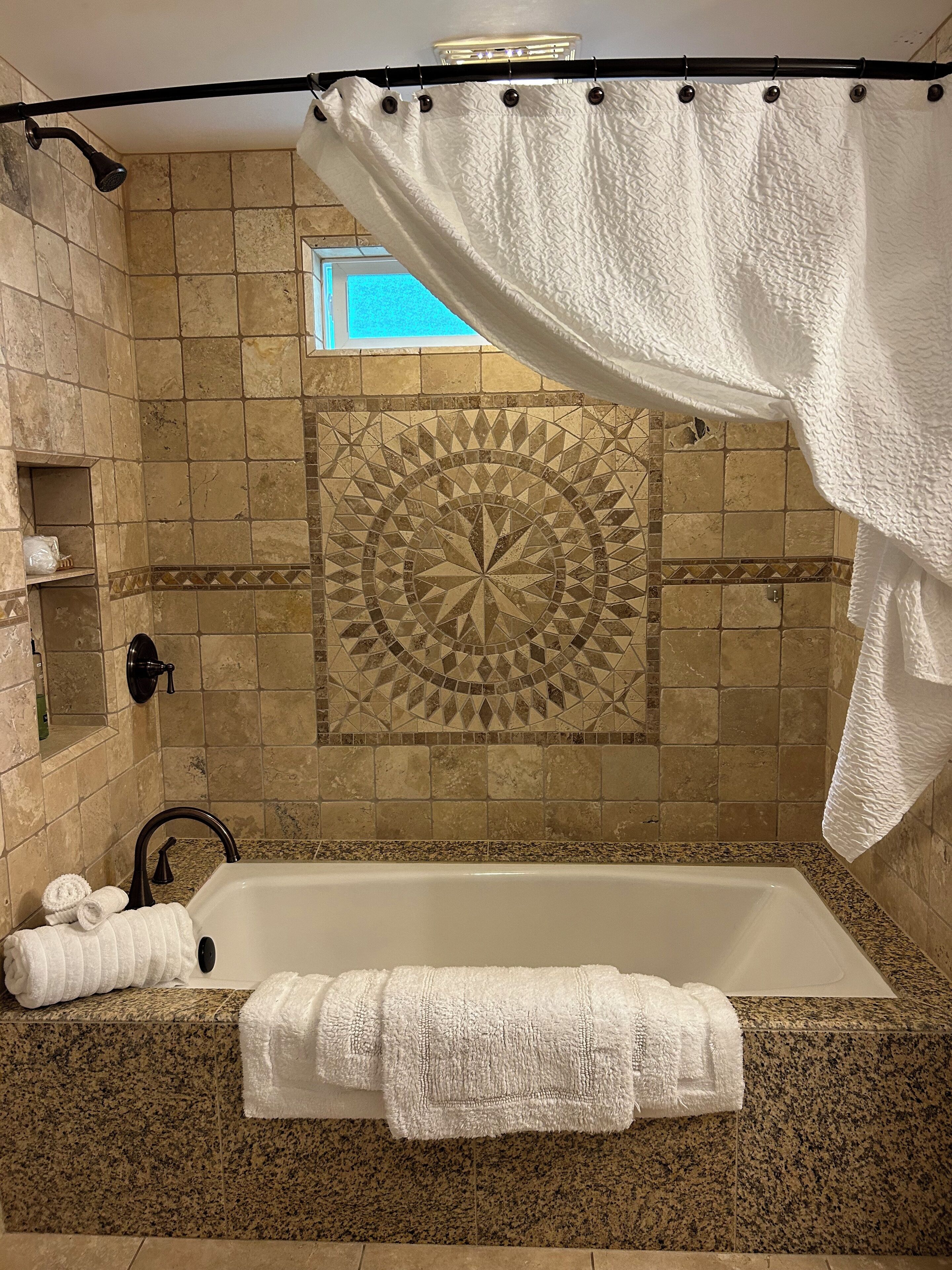 Combined shower/tub, hair dryer, towels, soap