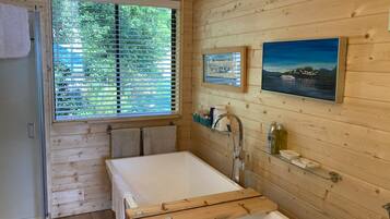 Bathtub, hair dryer, towels, soap