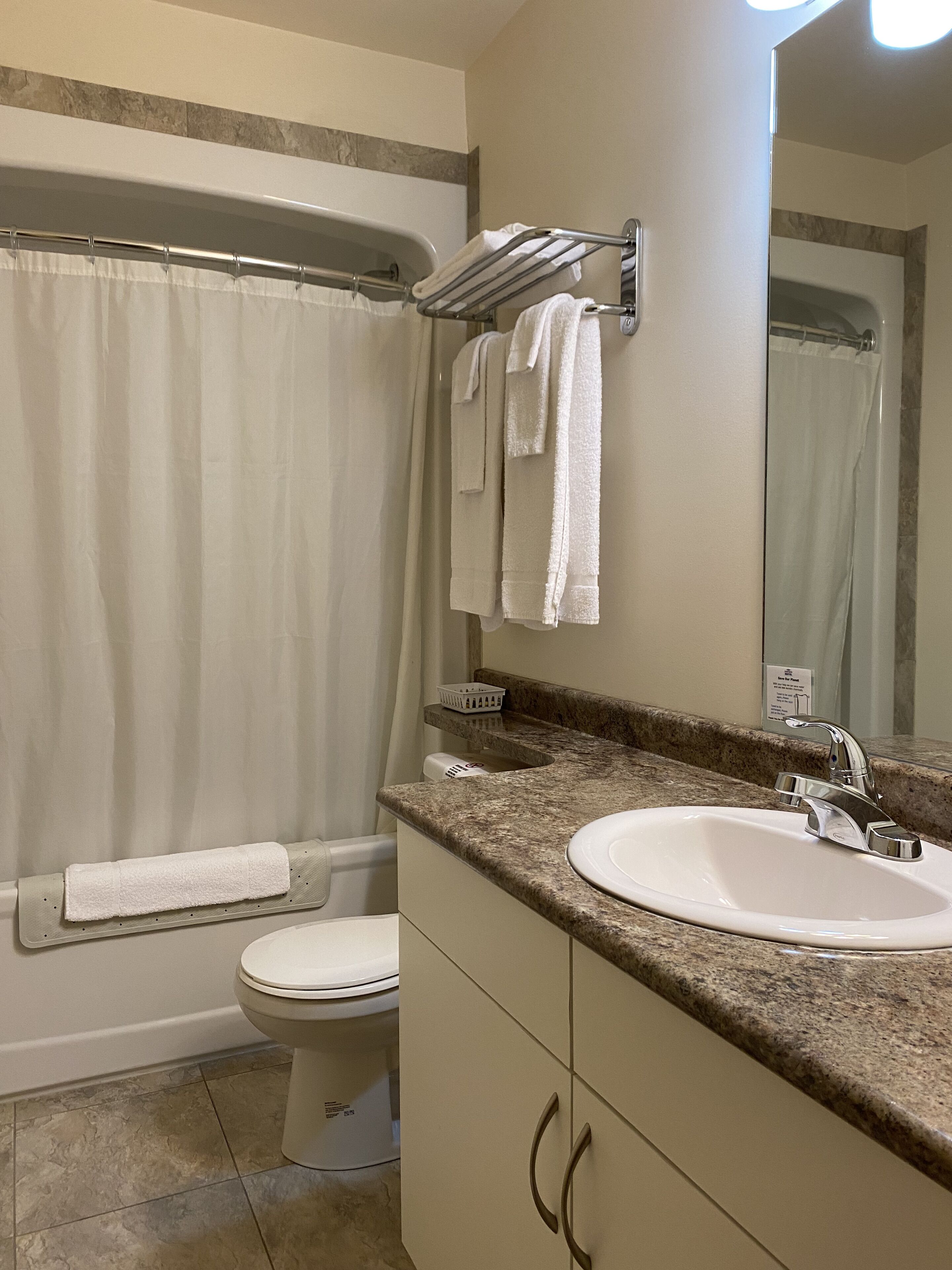 family room | bathroom | combined shower/bathtub, hair dryer, towels