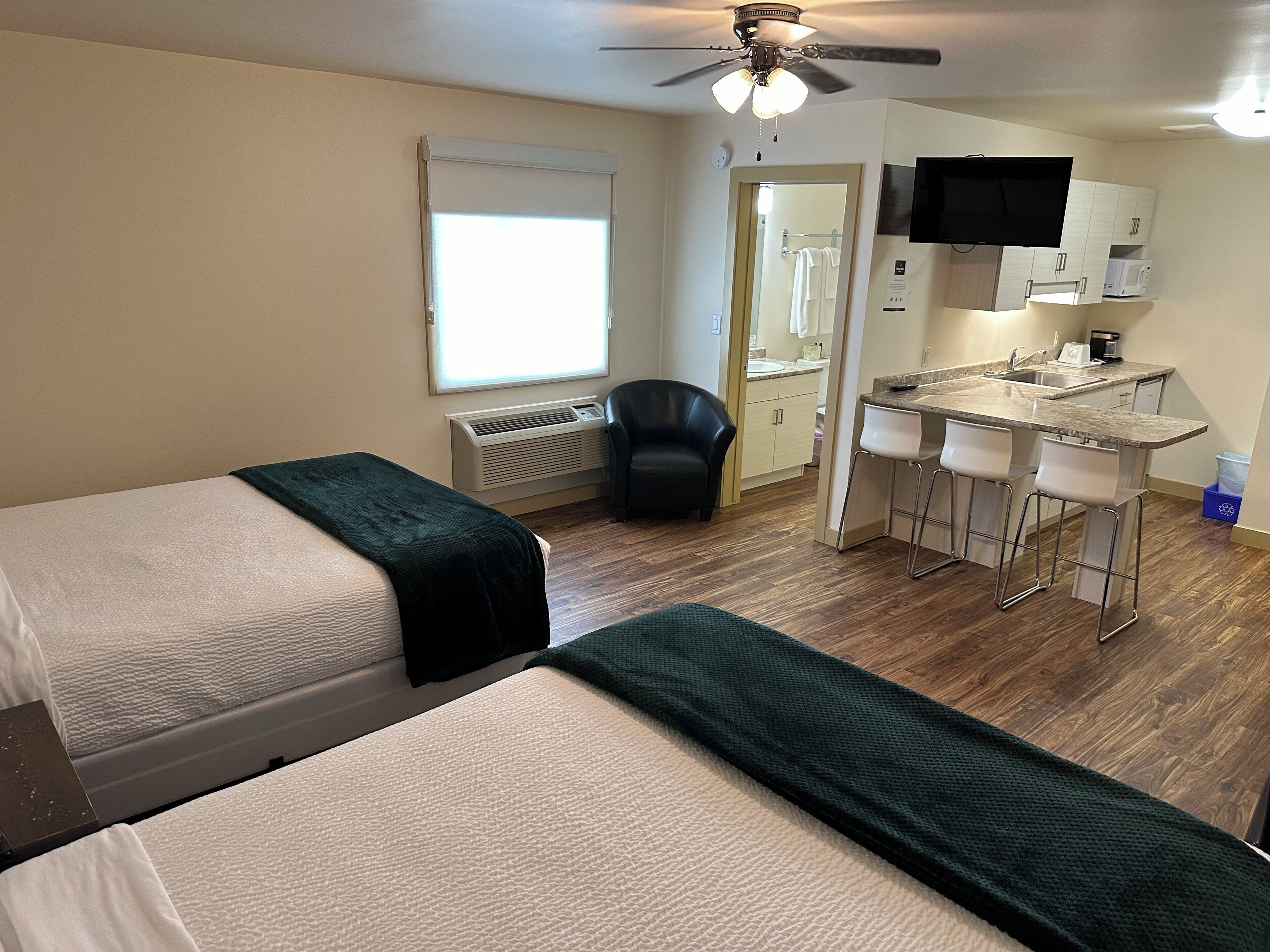 Signature Studio Suite | Individually furnished, desk, laptop workspace, blackout drapes