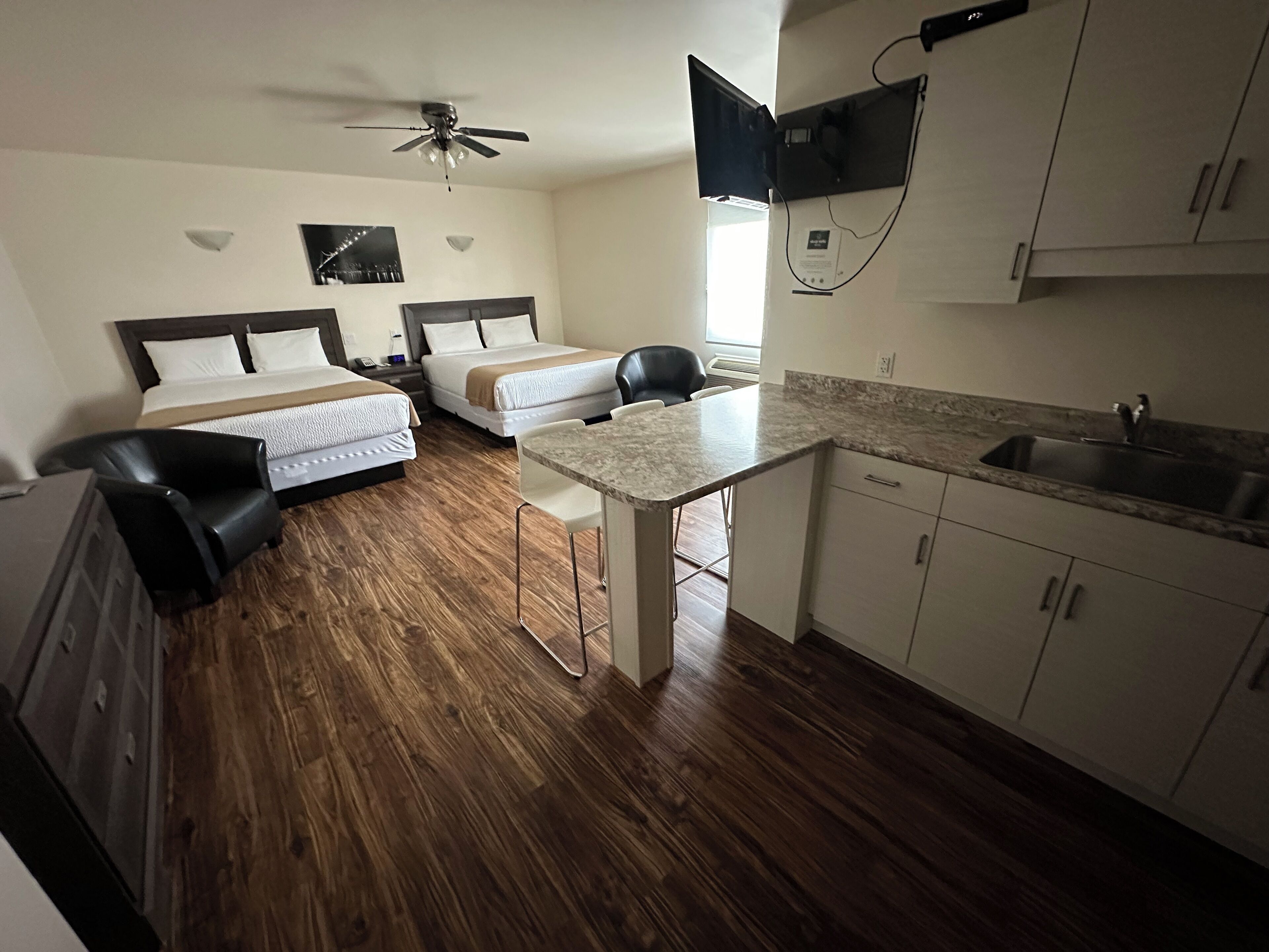 signature room | individually furnished, desk, laptop workspace, blackout curtains