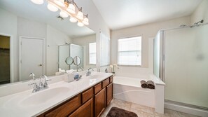 Combined shower/tub, towels, toilet paper