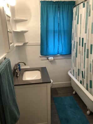 Combined shower/tub, hair dryer, towels, soap
