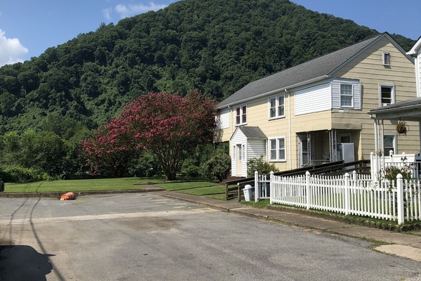 Parking in front of the apartment allows for one spot per unit. Others park road