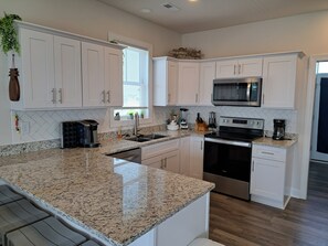 Fridge, microwave, oven, stovetop - New 4 Bed, 3 Bath, Pet-Friendly Home just minutes away from the beach. (North Topsail Beach)
