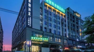 A multi-story hotel with a prominent sign indicating it is a hotel.