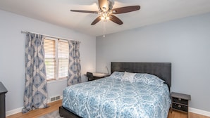 A bedroom with a bed, a desk, and a ceiling fan. - Central Tosa home near downtown, state fair, froedtert (Wauwatosa)