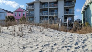 A beachfront building with multiple balconies and a private sign. - Oceanfront Getaway,  Directly on the Beach with Amazing Views (Surfside Beach)