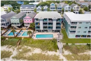 Relax by the pool overlooking the ocean and beach.