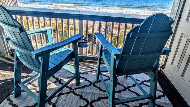 A balcony with two Adirondack chairs facing a beach. - Oceanfront Getaway,  Directly on the Beach with Amazing Views (Surfside Beach)