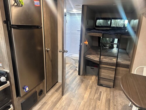 Vibe hilltop camper with Texas skyline