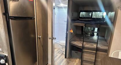 Vibe hilltop camper with Texas skyline