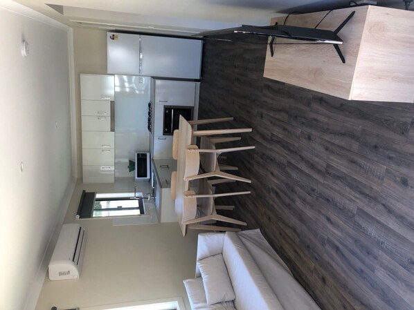 Cozy living space with a dining area, kitchen, and seating area.