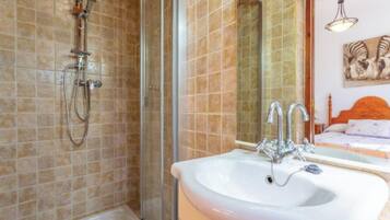 Bathtub, hair dryer, towels