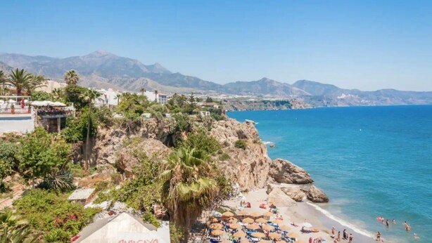 A coastal town with a beach, rocky cliffs, and mountains in the background. - Apartment "Villa San Salvador" with Sea View, Pool, Wi-Fi & Garden (Nerja)