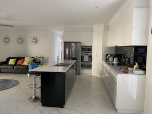 Enjoy a spacious living and dining area with a central island, perfect for cooking and socializing.
