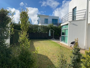 Enjoy the serene surroundings and expansive views from the balcony of this contemporary property.