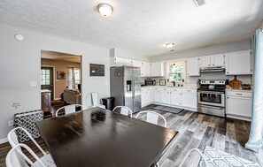 Enjoy cooking in this well-equipped kitchen with a gas stove, microwave, and refrigerator.