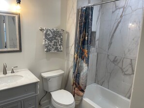 Combined shower/tub, hair dryer, towels, soap