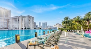 Relax by the pool with a stunning view of the city skyline.