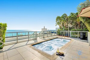 Relax and unwind on the rooftop terrace with a hot tub and ocean views.
