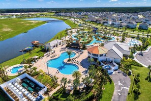 A resort with a large swimming pool, a water park, and a golf course.
