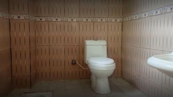 Standard Double Room | Bathroom | Shower, free toiletries, slippers, towels