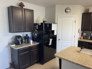 Coffee/tea maker, fridge, microwave, oven