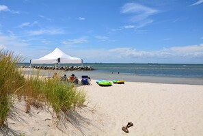 Relax in a shaded beachside retreat with a tent and enjoy the ocean views.