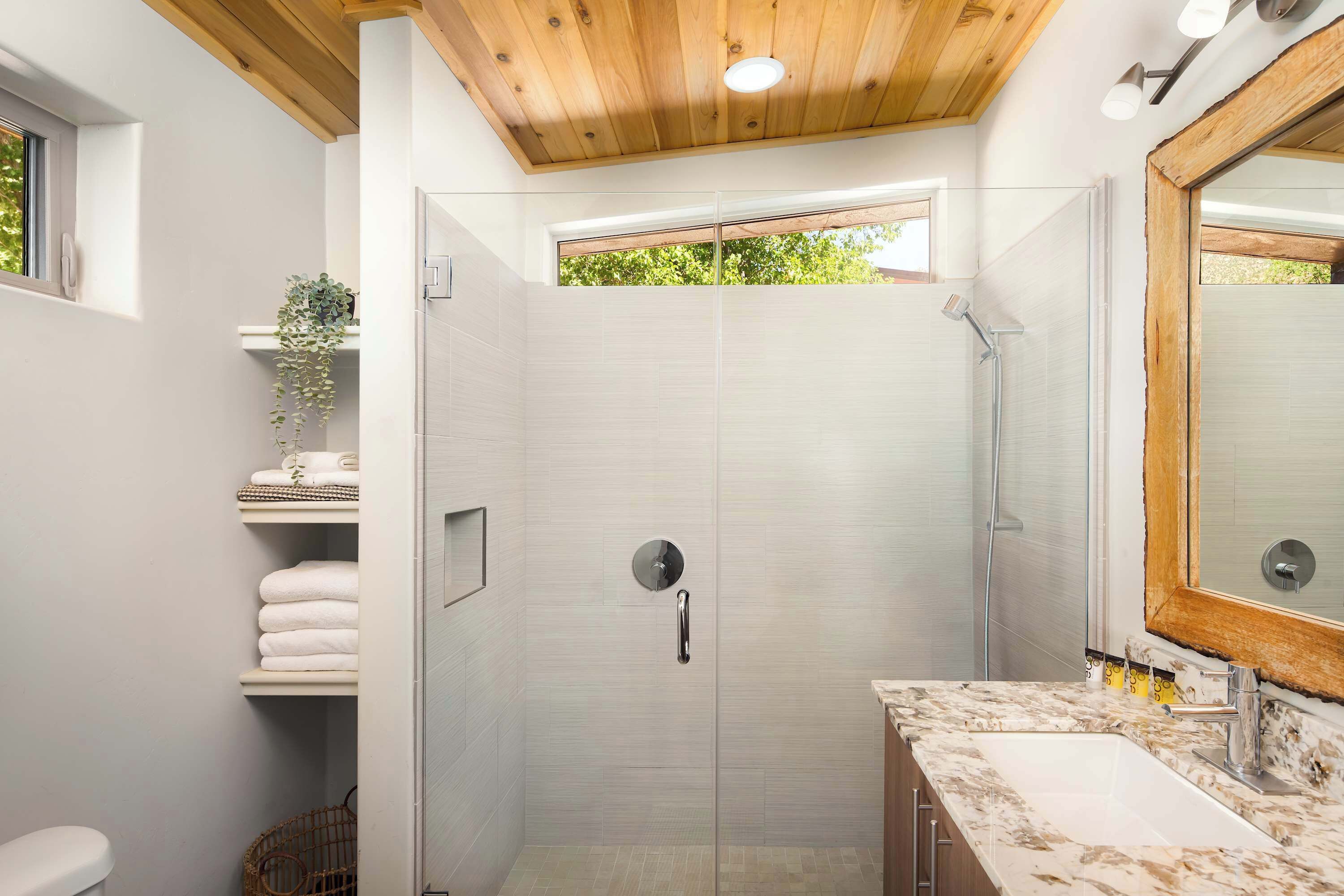 Shower, hair dryer, towels, shampoo