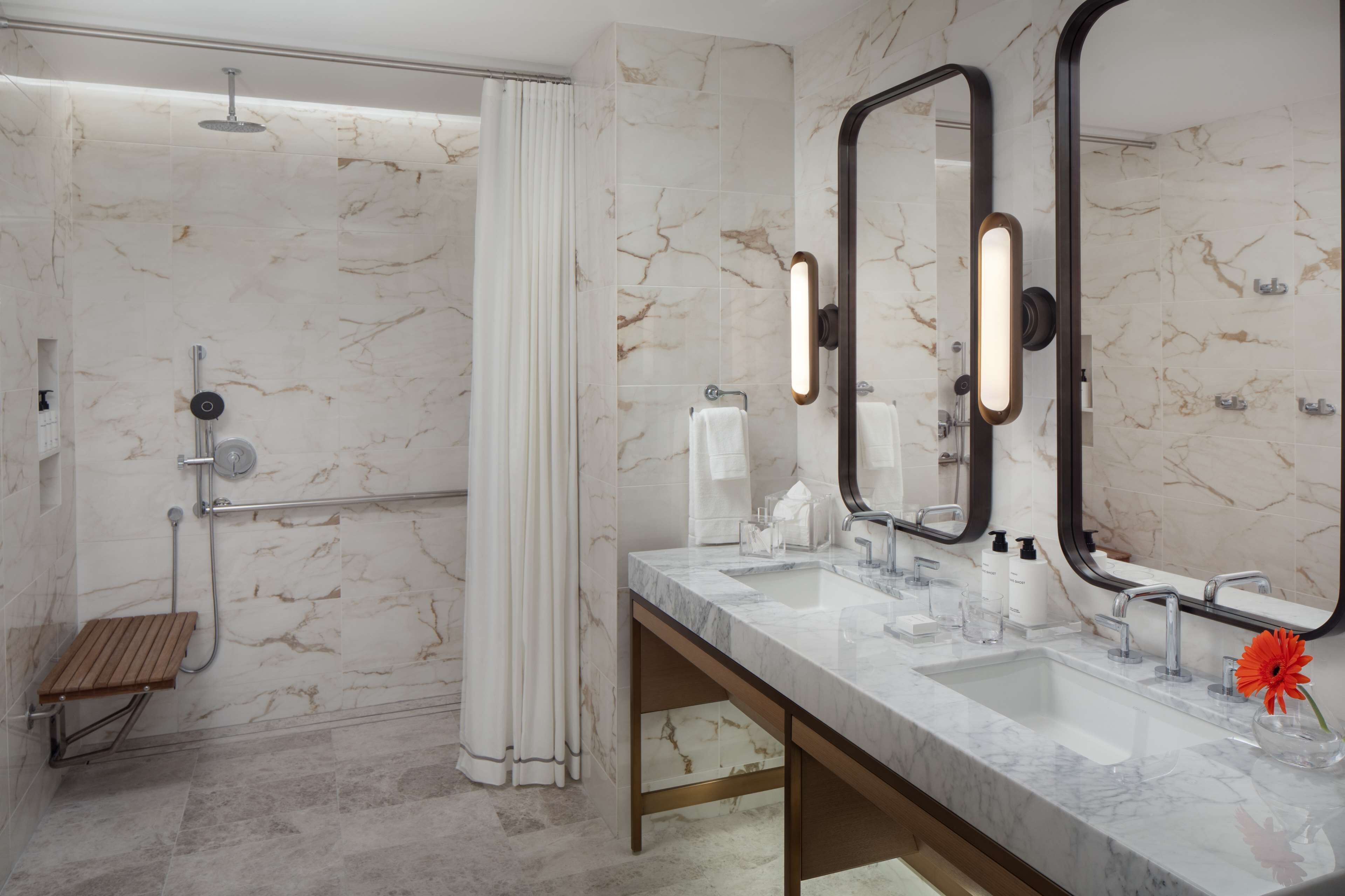 deep-soaking bathtub, rainfall showerhead, designer toiletries