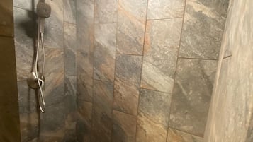 Shower, hair dryer, towels, toilet paper