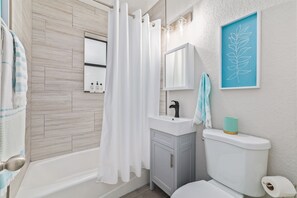 Shower, hair dryer, towels