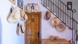 A wooden door with a metal staircase to the right. - Casa Angelica Cómpeta by Ruralidays (Málaga)