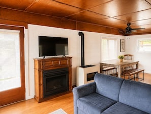 TV, fireplace - Quiet Lakefront Cabin · Private Dock and Firepit (Bath)