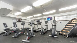 A gym with treadmills, elliptical machines, and a stair climber. - 🗝18th Floor Corner Studio of Hawaiian Monarch w/Awesome Pool in Waikiki (Honolulu)