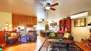 A cozy living room with a fireplace, a dining area, and a kitchen. -  Spacious- 11 min to Yosemite toll- 13 guests- 7+ beds, pet- game room- 2000 Ft (Oakhurst)