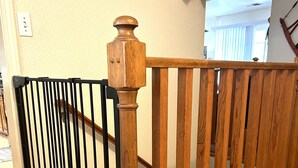 A wooden staircase with a black metal railing. -  Spacious- 11 min to Yosemite toll- 13 guests- 7+ beds, pet- game room- 2000 Ft (Oakhurst)