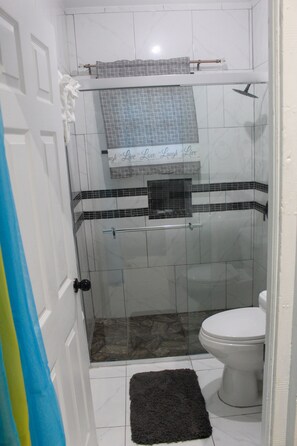 Shower, hair dryer, towels, soap - Serenity's Condo 2 Bedroom Apartment (Montego Bay)