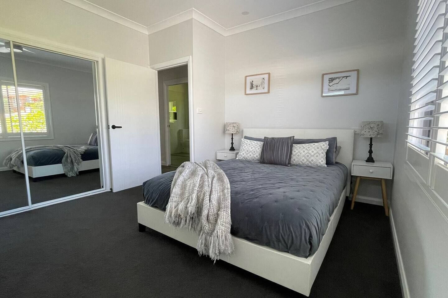 Main bedroom Queen Bed with large wardrobe and extra Pillows and Blankets